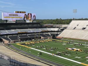A photo of Director Desiree Reed-Francois on the LED screen at Faurot Field.
