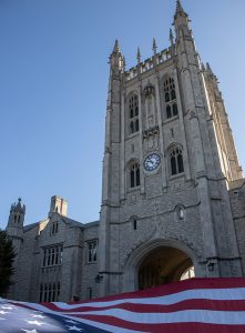 A photo of Memorial Union with an American flag.