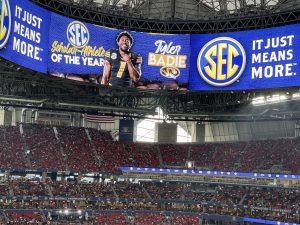A photo of an digital screen announcing Tyler Badie is SEC Football Scholar-Athlete of the Year.