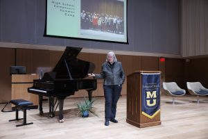 A photo of Dr. Jeanne Sinquefield on-stage in the Sinquefield Music Center.