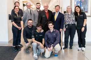 A photo of Interim Dean Cooper Drury, Head Coach Cristian Chirila, Rex Sinquefield, President Choi and Dr. Jeanne Sinquefield surrounded by members of the MU Chess Team.
