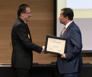 A photo of President Choi congratulating Yicheng Guo during the 2022 Faculty Recognition Awards Reception & Ceremony in the State Historical Society of Missouri.