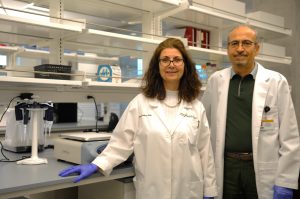 A photo of Drs. Esma Yolcu and Havla Shirwan in a lab.