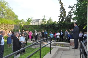 A photo of President Choi addressing new faculty reception attendees at the Residence on Francis Quadrangle.