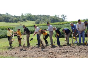 A photo of Pres. Choi and others breaking ground on a new machine shed during the Graves-Chapple Extension and Education Center field day.