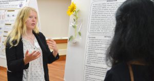 A photo of Randi Noel presenting her research.
