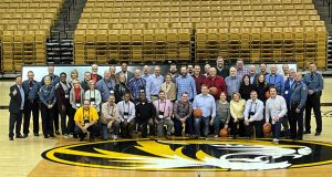 A photo of President Choi with the President Choi with the tour group in Mizzou Arena.