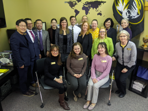 A photo of President Choi and John Middleton, associate vice president for Academic Affairs, with staff from Study Abroad and International Programs.