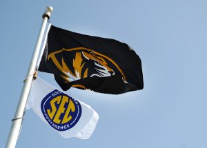 A photo of a Mizzou flag and an SEC flag.