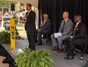 A photo of President Choi addressing those gathered at the groundbreaking alongside (from left to right) Gov. Mike Parson, MURR Executive Director Matt Sanford and University of Missouri Board of Curators chair Michael Williams.