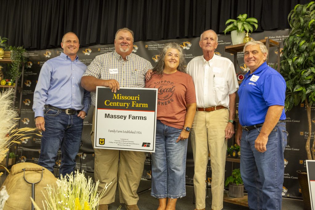 Missouri Farm Bureau President Hawkins (left) and Missouri Farm Bureau District 6 Board Member Brian Koenig (right) with the Massey family, who received certification as a Missouri Century Farm for having farmed their land for 100 years or more.