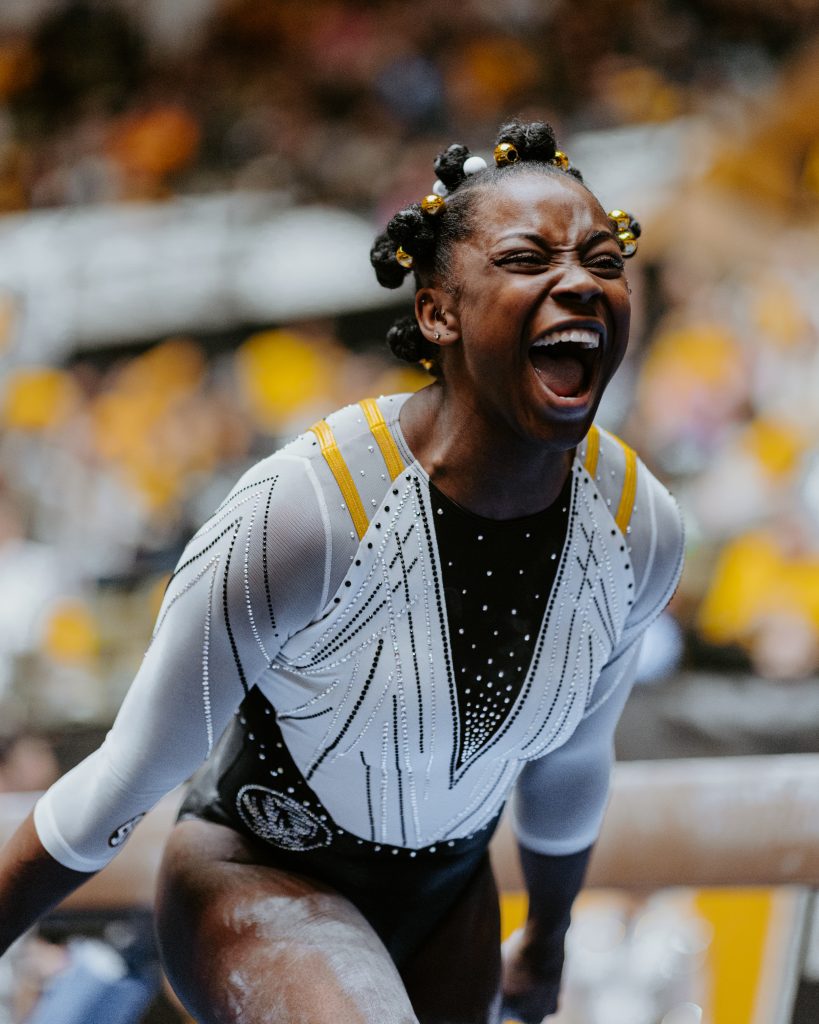 Senior Amari Celestine celebrates during her all-around routine against Auburn.