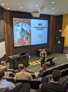 A photo of President Choi talking with College of Engineering faculty and staff in Ketcham Auditorium.