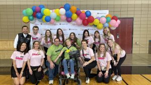 A photo of President Choi with the Luebbering family and members of MizzouThon’s executive board.