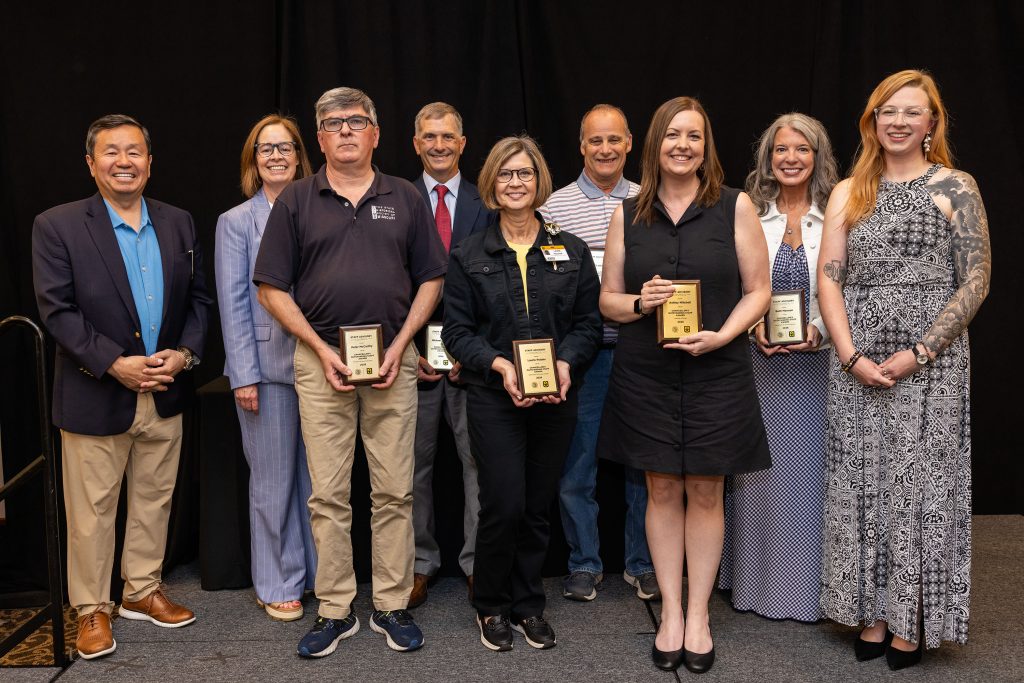 President Choi and Vice President for Human Resources Marsha Fischer with the six Chancellor’s Outstanding Staff Award winners and Staff Advisory Council Chair Kelsie Gibler